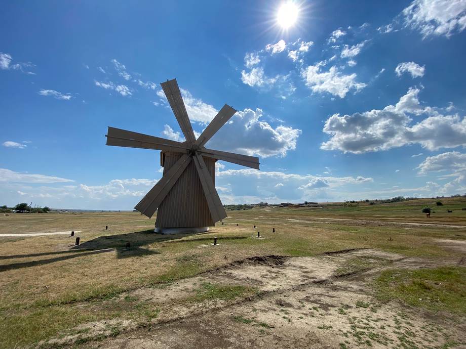 Historic wooden windmill landmark in rural Moldova landscape