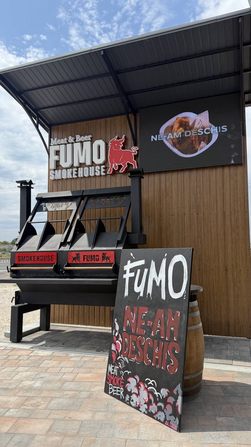 Fumo smokehouse and beer bar exterior with branded signage and wood facade