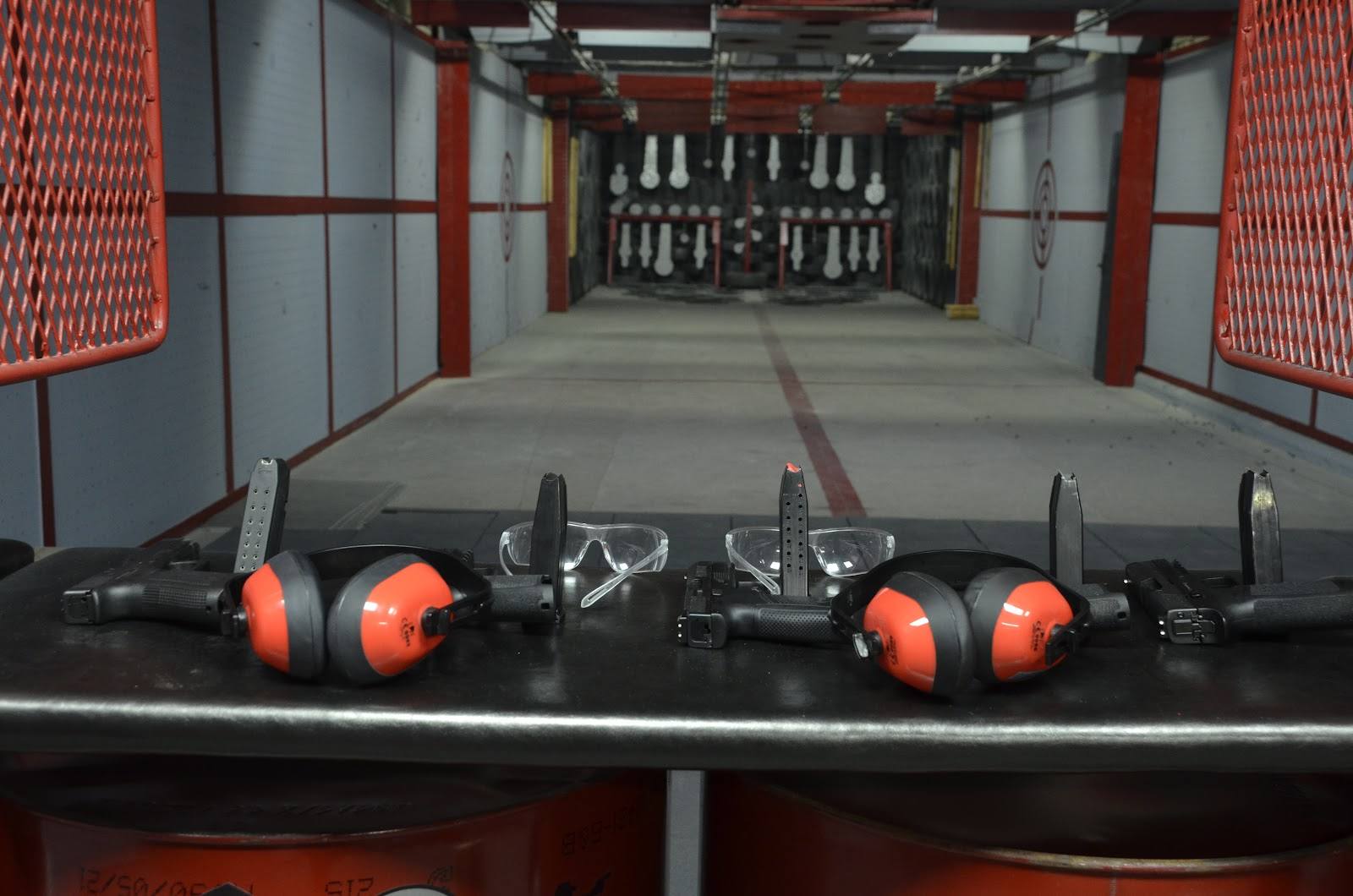 Go-kart racing track with red bumpers and indoor racing lane