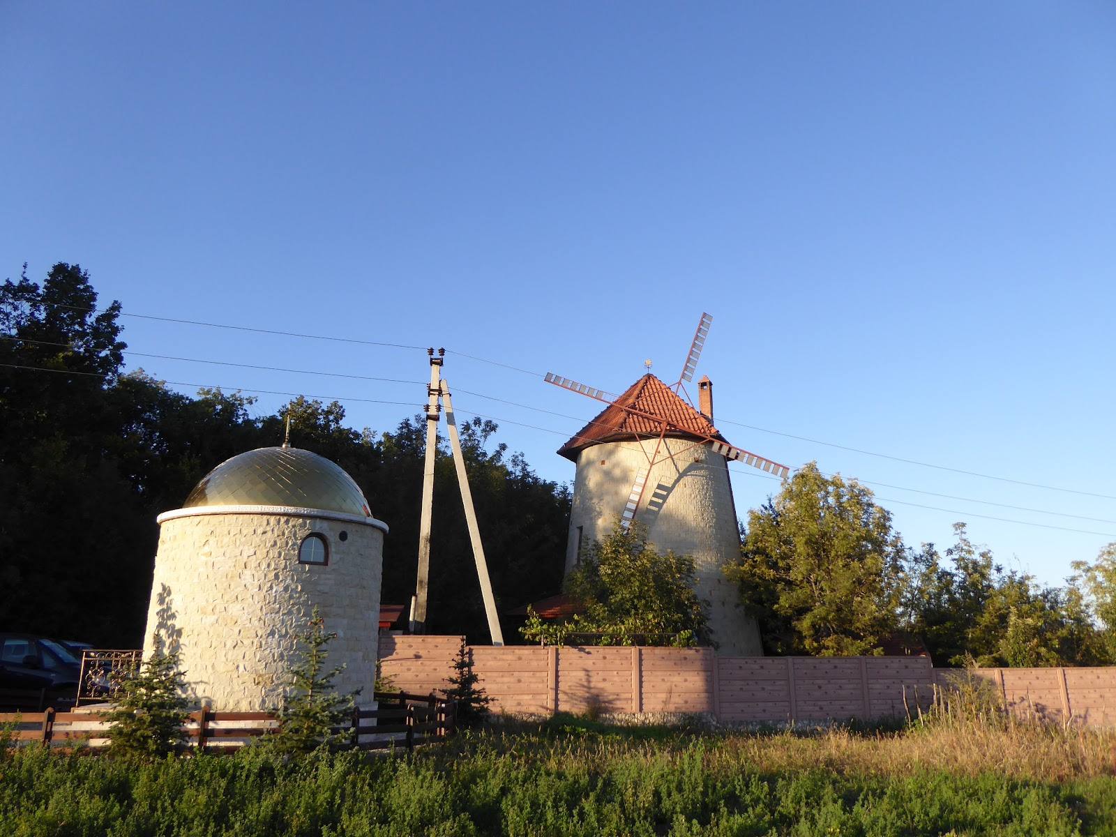 Historic windmills with copper roof against clear sky in rural Moldova