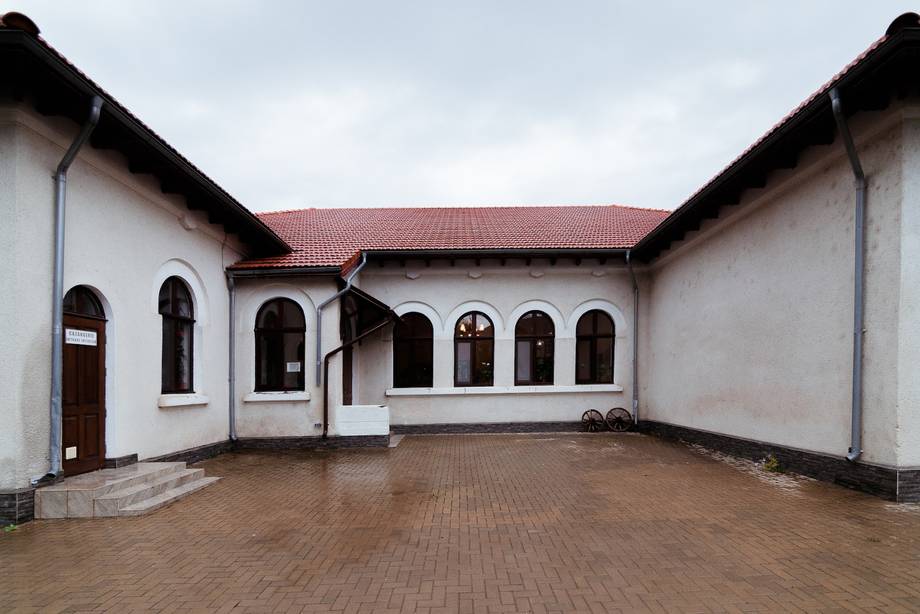 Monastery courtyard with white-washed walls and arched windows