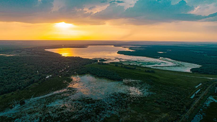Aerial sunset over wetlands and river landscape in Moldova