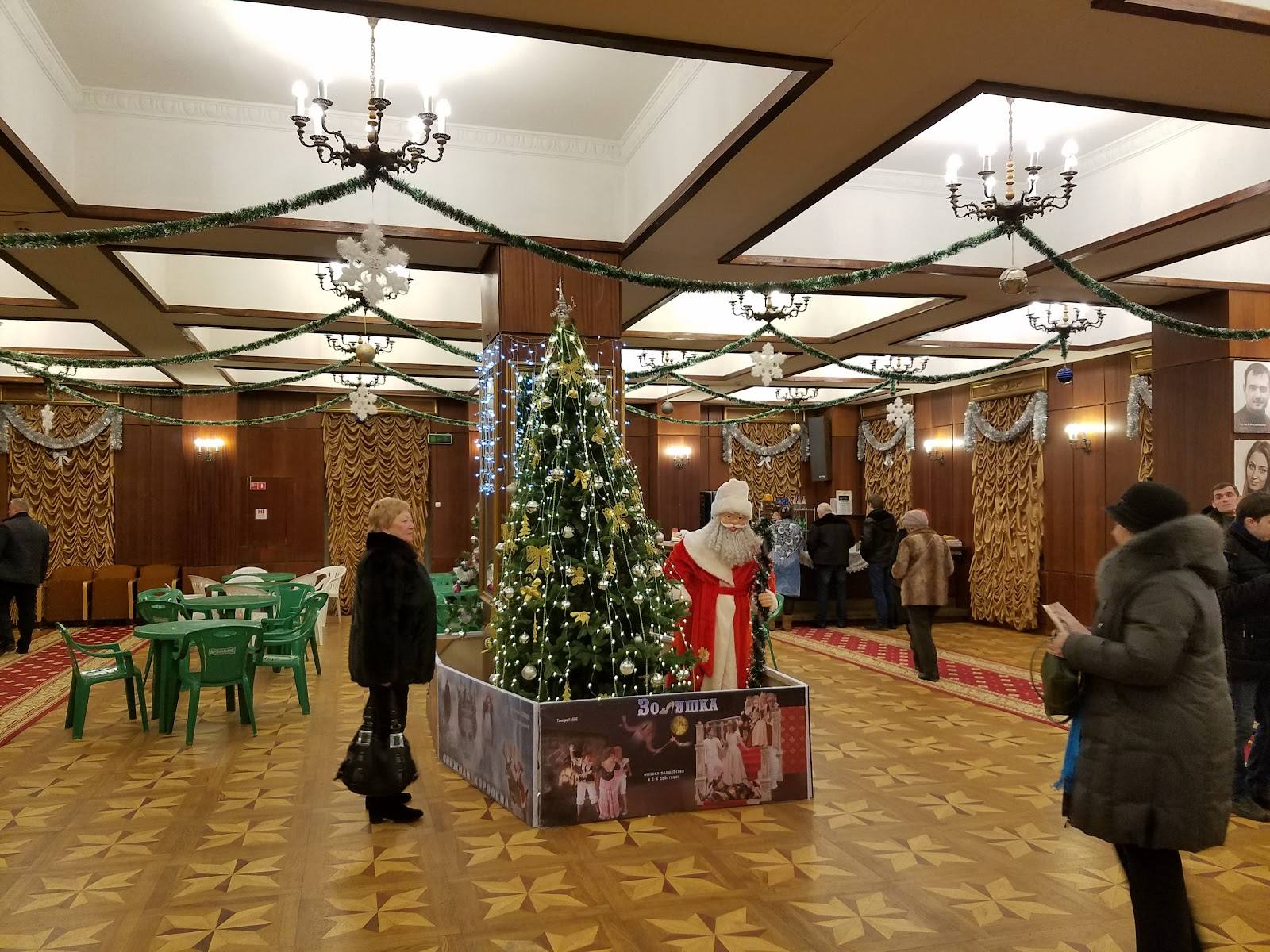 Elegant hotel ballroom interior with decorative Christmas tree, coffered ceiling, and festive atmosphere
