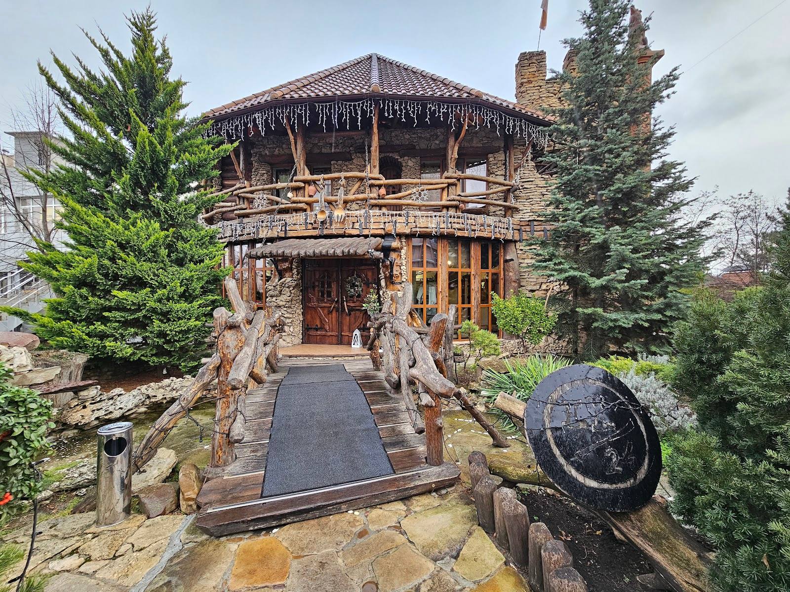 Historic stone monastery with distinctive architecture and landscaped grounds