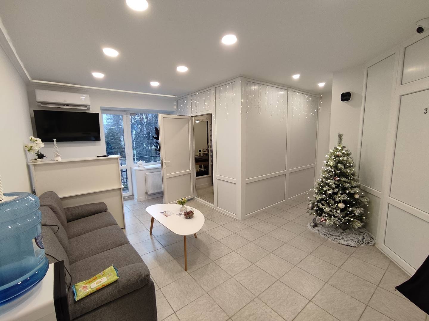 Modern spa reception area with clean white interior and welcoming seating
