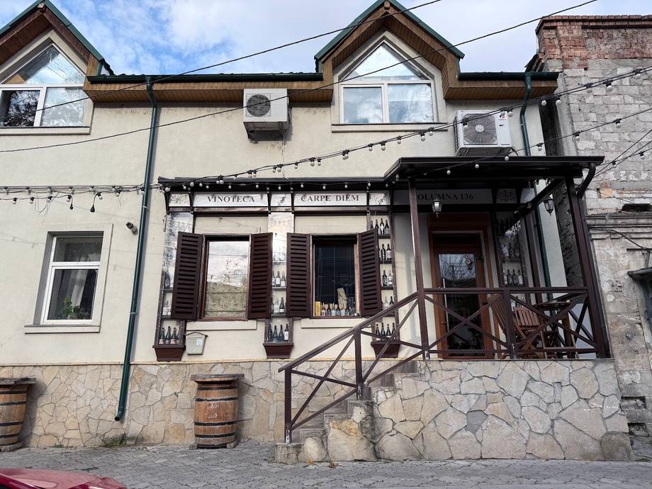Storefront facade with covered entrance and distinctive architectural features