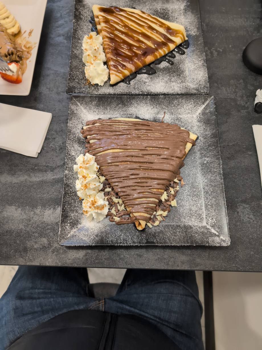 Plated chocolate desserts with caramel drizzle and popcorn garnish